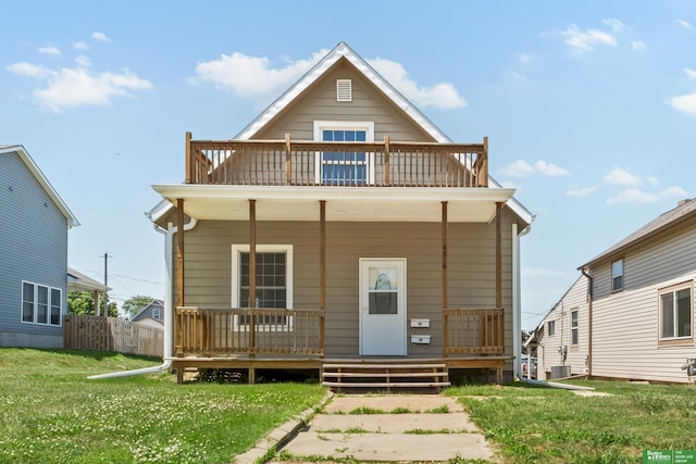 4516 S 33rd St, Omaha, NE 68107 - rear view of property with a balcony, covered porch, and a yard