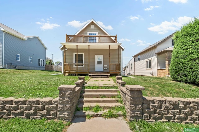 4516 S 33rd St, Omaha, NE 68107 - view of front of property with a balcony, a front lawn, and a porch