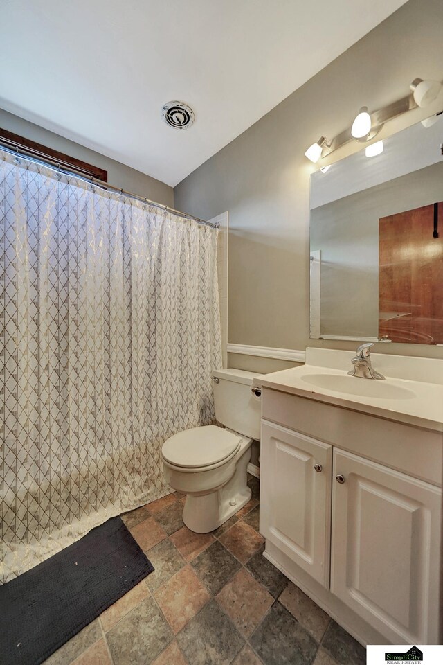 4721 Woodhaven Dr, Lincoln, NE 68516 - full bath featuring stone tile flooring and vanity