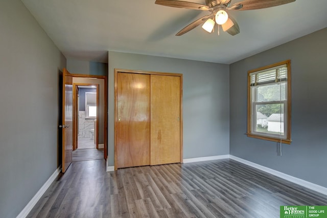 4317 S 37th St, Omaha, NE 68107 - unfurnished bedroom with wood finished floors, a closet, and a ceiling fan