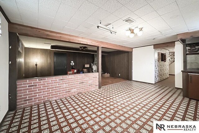 4520 Polk St, Omaha, NE 68117 - finished basement featuring wood walls and carpet floors