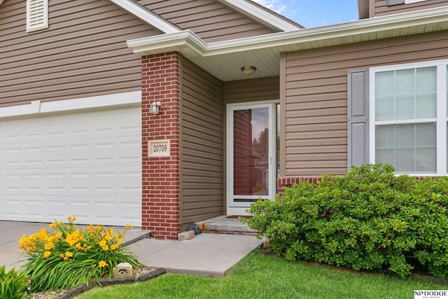 20709 Larimore Ave, Elkhorn, NE 68022 - doorway to property with brick siding and driveway