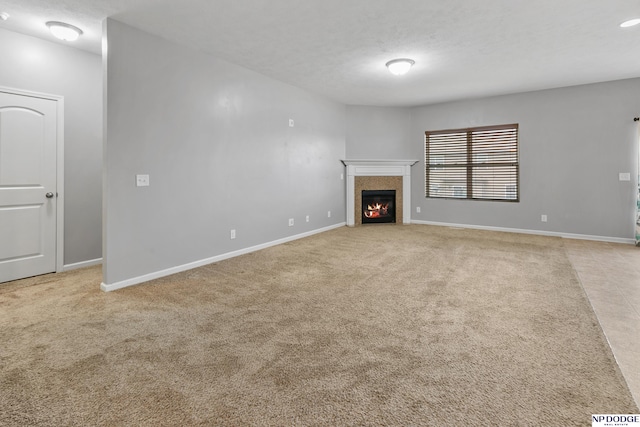 20709 Larimore Ave, Elkhorn, NE 68022 - unfurnished living room featuring a tile fireplace and light colored carpet