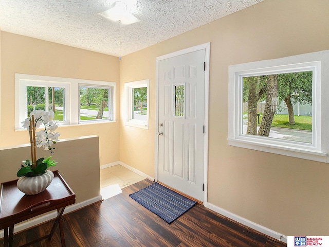 4308 N 70th St, Lincoln, NE 68507 - foyer with wood finished floors and a textured ceiling