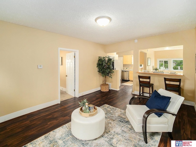 4308 N 70th St, Lincoln, NE 68507 - sitting room featuring dark wood-style floors and a textured ceiling