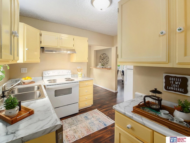 4308 N 70th St, Lincoln, NE 68507 - kitchen with electric range, under cabinet range hood, dark wood-type flooring, light countertops, and a textured ceiling