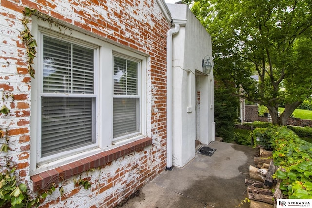5802 Pacific St, Omaha, NE 68106 - doorway to property with brick siding