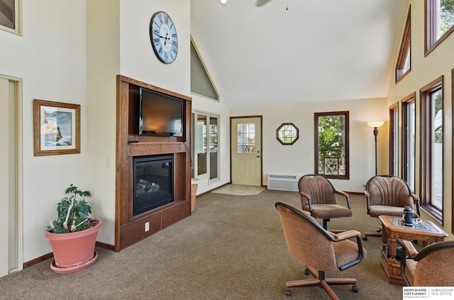 2618 Platte River Dr, Bellevue, NE 68123 - carpeted living area with high vaulted ceiling, a glass covered fireplace, and ceiling fan