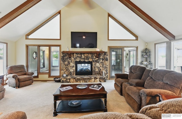 2618 Platte River Dr, Bellevue, NE 68123 - carpeted living room featuring high vaulted ceiling, beamed ceiling, and a stone fireplace