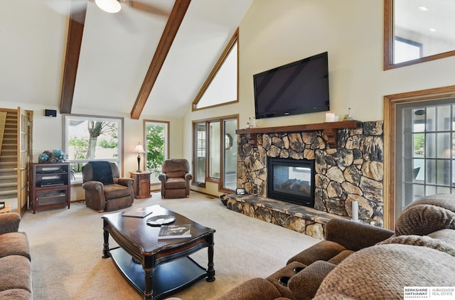 2618 Platte River Dr, Bellevue, NE 68123 - living room featuring high vaulted ceiling, carpet, a stone fireplace, plenty of natural light, and beamed ceiling