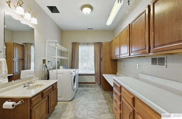 2618 Platte River Dr, Bellevue, NE 68123 - washroom featuring washing machine and clothes dryer and cabinet space