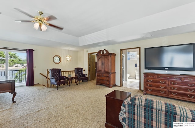 2618 Platte River Dr, Bellevue, NE 68123 - living room featuring carpet flooring, ceiling fan, a raised ceiling, and a chandelier