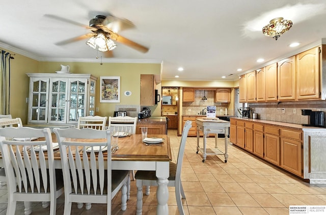 2618 Platte River Dr, Bellevue, NE 68123 - dining space with a ceiling fan, light tile patterned flooring, crown molding, and recessed lighting