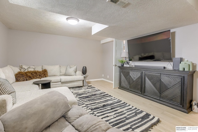 534 Piedmont Dr, Omaha, NE 68154 - living area featuring light wood-style flooring and a textured ceiling