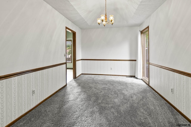 3728 Schuemann Dr, Bellevue, NE 68123 - spare room featuring plenty of natural light, a chandelier, and carpet floors