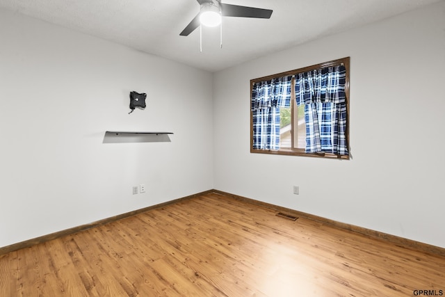 3728 Schuemann Dr, Bellevue, NE 68123 - unfurnished room featuring wood finished floors and a ceiling fan