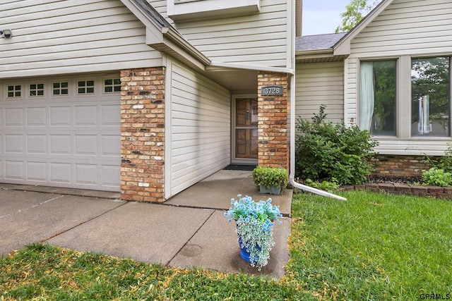 3728 Schuemann Dr, Bellevue, NE 68123 - entrance to property featuring a garage and brick siding