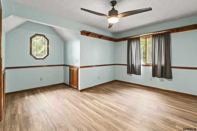 3728 Schuemann Dr, Bellevue, NE 68123 - empty room with a ceiling fan, light wood-type flooring, a textured ceiling, and lofted ceiling
