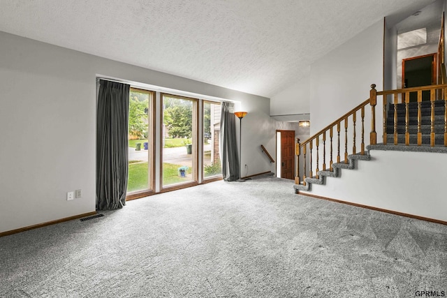 3728 Schuemann Dr, Bellevue, NE 68123 - unfurnished living room featuring carpet, a textured ceiling, stairs, and vaulted ceiling
