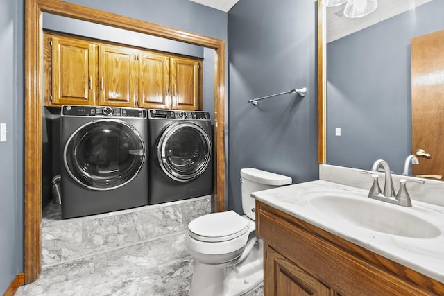 3728 Schuemann Dr, Bellevue, NE 68123 - bathroom featuring washing machine and dryer, vanity, and bathtub / shower combination