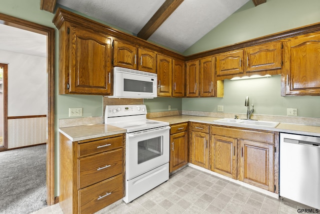 3728 Schuemann Dr, Bellevue, NE 68123 - kitchen with white appliances, light countertops, and brown cabinets