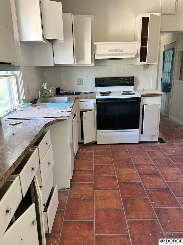 2932 N 50th St, Lincoln, NE 68504 - kitchen featuring electric range, under cabinet range hood, white cabinetry, and decorative backsplash