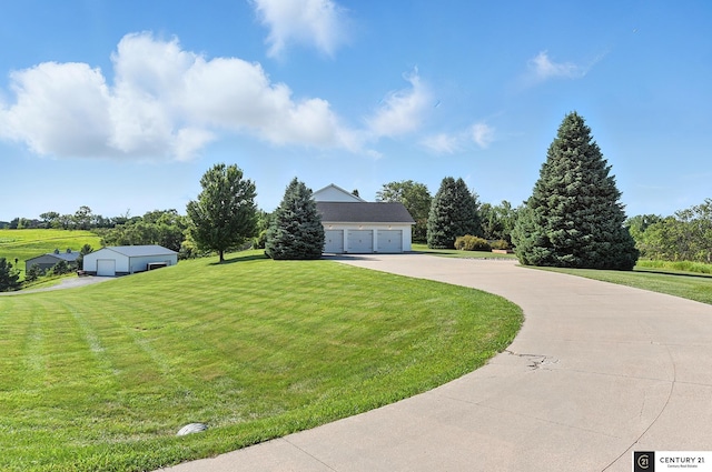 4806 Steavenson Loop, Blair, NE 68008 - view of front of home featuring a front yard, a garage, and an outbuilding