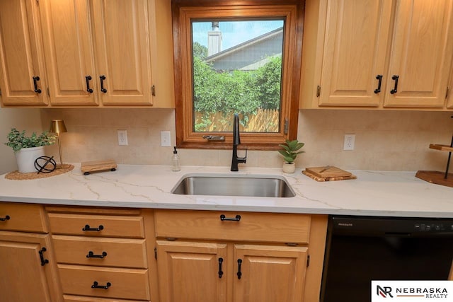 506 Rockhurst Dr, Lincoln, NE 68510 - kitchen with black dishwasher, backsplash, and light stone countertops