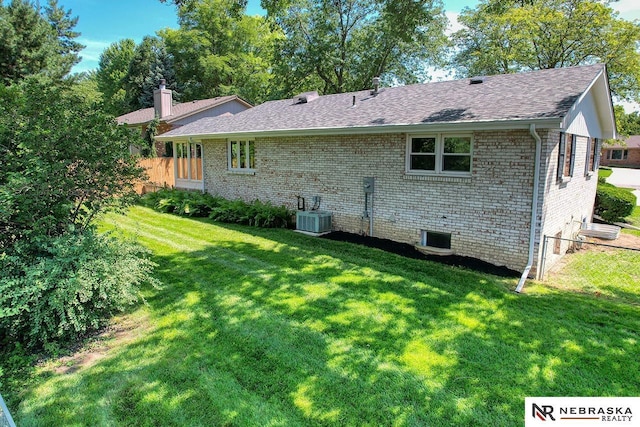 506 Rockhurst Dr, Lincoln, NE 68510 - rear view of property featuring brick siding and a shingled roof