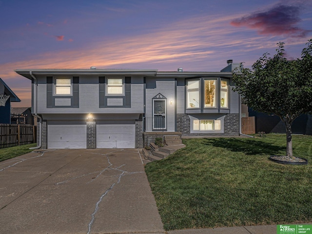 8006 S 154th St, Omaha, NE 68138 - bi-level home with an attached garage and concrete driveway