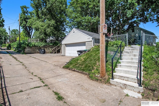 1422 S 52nd St, Omaha, NE 68106 - view of home's exterior featuring stairs and a garage