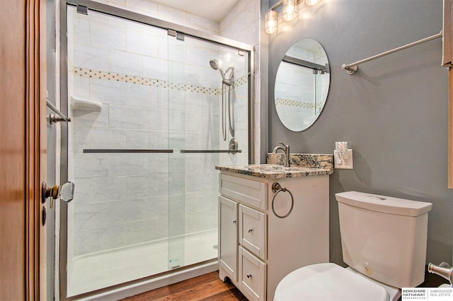 1422 S 52nd St, Omaha, NE 68106 - full bath featuring a shower stall, vanity, and wood finished floors