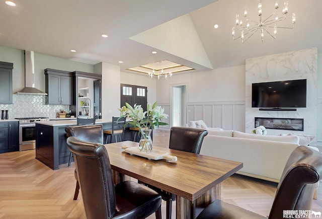 8150 S 185th St, Omaha, NE 68136 - dining area featuring a chandelier, recessed lighting, and wainscoting
