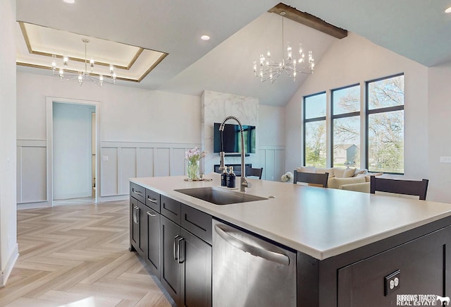 8150 S 185th St, Omaha, NE 68136 - kitchen featuring dishwasher, a chandelier, light countertops, decorative light fixtures, and a wainscoted wall