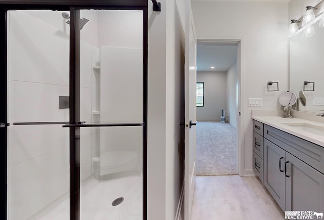 8150 S 185th St, Omaha, NE 68136 - full bathroom with vanity, a shower stall, and wood finished floors