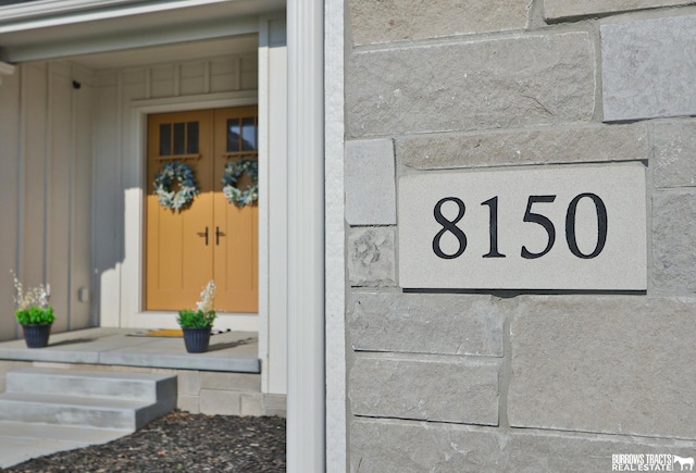 8150 S 185th St, Omaha, NE 68136 - entrance to property with board and batten siding