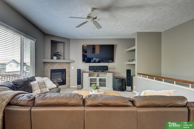 1608 Old Gaelic St, Bellevue, NE 68123 - living room featuring a fireplace, a textured ceiling, and ceiling fan