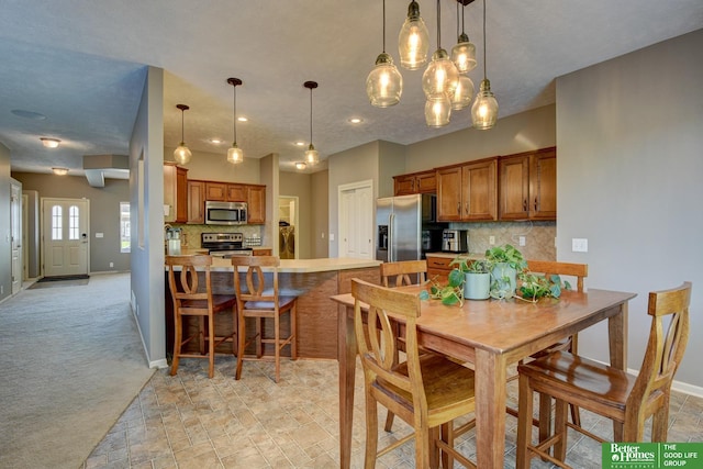 1608 Old Gaelic St, Bellevue, NE 68123 - dining room featuring light colored carpet, a chandelier, and recessed lighting