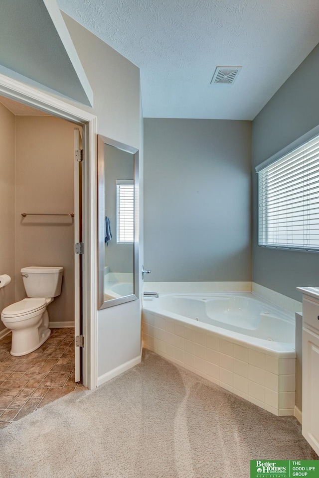 1608 Old Gaelic St, Bellevue, NE 68123 - full bath with a garden tub, plenty of natural light, vanity, a textured ceiling, and carpet