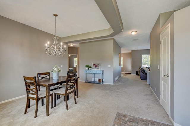 1608 Old Gaelic St, Bellevue, NE 68123 - dining area featuring light colored carpet and a chandelier