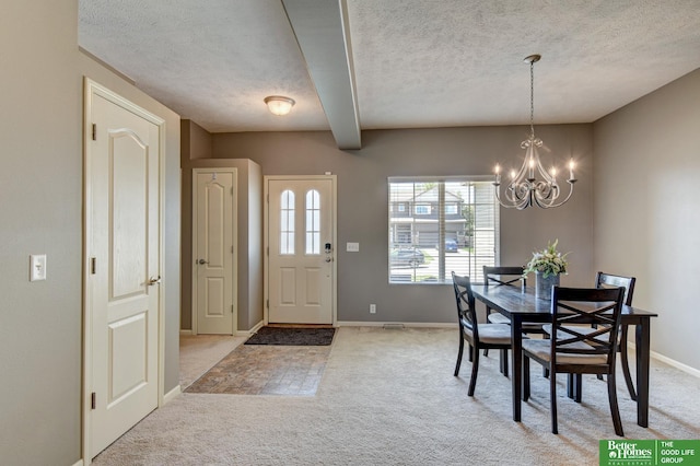 1608 Old Gaelic St, Bellevue, NE 68123 - dining area featuring light colored carpet, a textured ceiling, a chandelier, and beam ceiling
