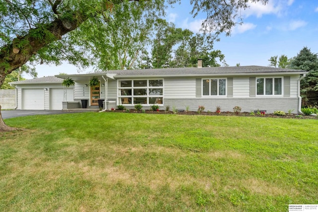 1133 S 96th St, Omaha, NE 68124 - view of front of house with driveway, an attached garage, a front yard, and a chimney