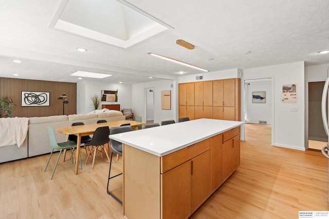 1133 S 96th St, Omaha, NE 68124 - kitchen featuring a center island, light wood finished floors, open floor plan, and recessed lighting