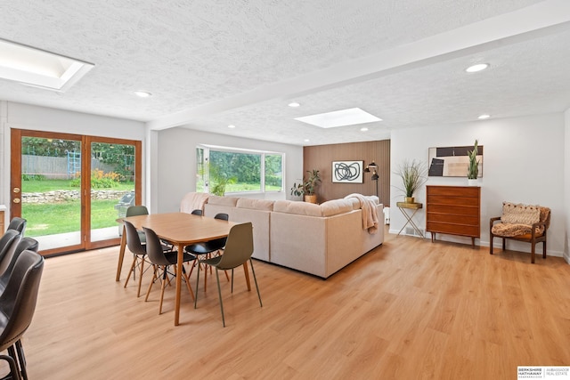 1133 S 96th St, Omaha, NE 68124 - dining room with a skylight, a textured ceiling, recessed lighting, and light wood finished floors
