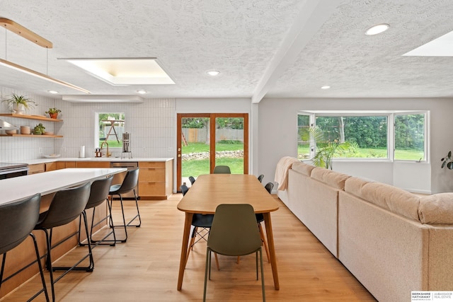 1133 S 96th St, Omaha, NE 68124 - dining area featuring a textured ceiling, recessed lighting, and light wood-style floors