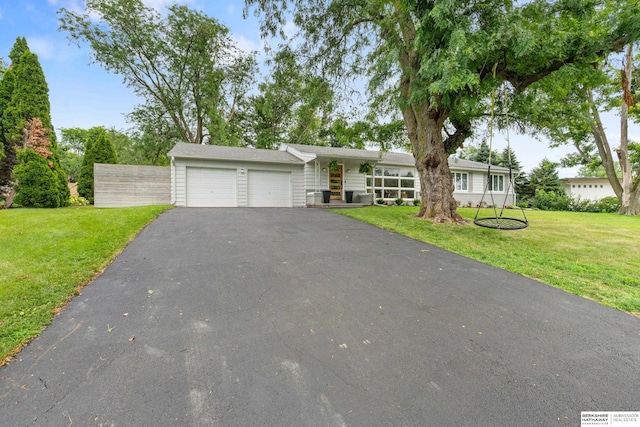1133 S 96th St, Omaha, NE 68124 - view of front of house with driveway, an attached garage, and a front yard