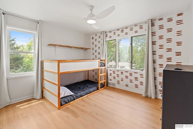 1133 S 96th St, Omaha, NE 68124 - bedroom featuring wood finished floors, multiple windows, and a ceiling fan