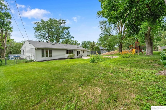 1133 S 96th St, Omaha, NE 68124 - view of yard featuring a playground and a patio area