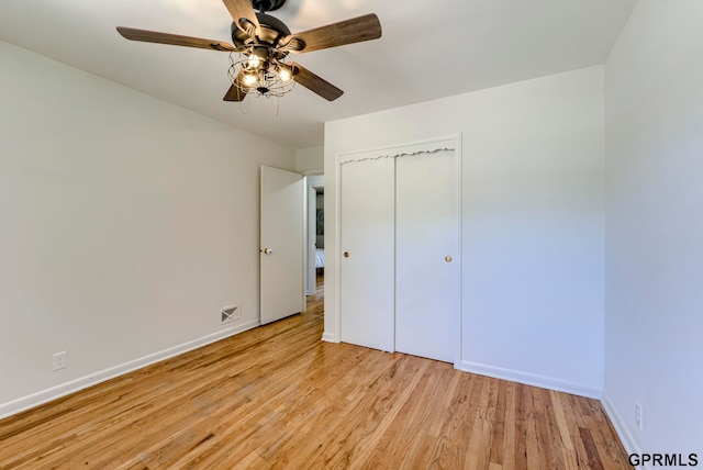 4509 Ridgeway Rd, Omaha, NE 68134 - unfurnished bedroom with light wood-style flooring, a closet, and ceiling fan