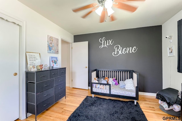 4509 Ridgeway Rd, Omaha, NE 68134 - bedroom featuring light wood-style flooring and a ceiling fan